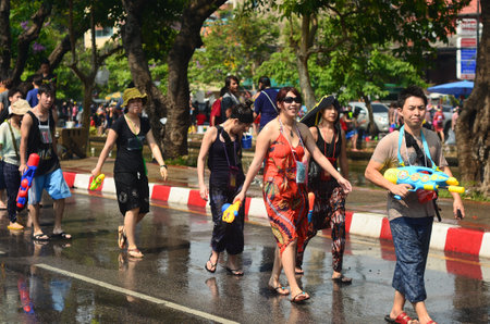 CHIANG MAI, THAILAND - APRIL 13   People celebrating Songkran  Thai new year   water festival  in the streets by throwing water at each other on 13 April 2014 in Chiang Mai, Thailand のeditorial素材