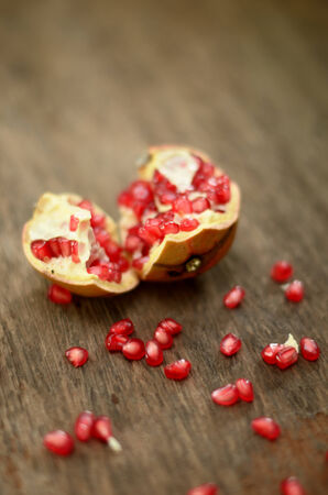 Pomegranate on wooden tableの写真素材