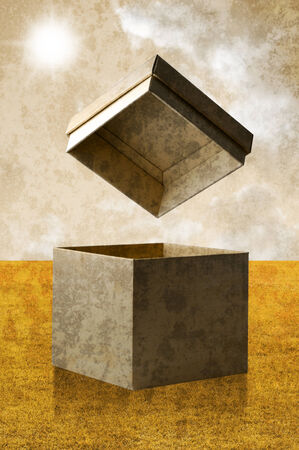 Open paper box with nice field background in vintage styleの写真素材
