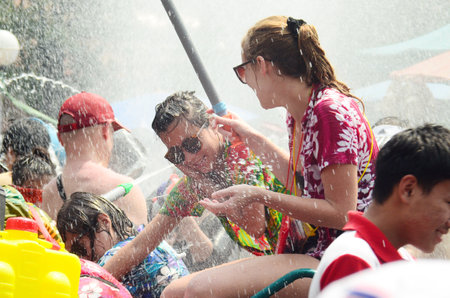 CHIANG MAI, THAILAND - APRIL 15 : People celebrating Songkran water festival in the streets by throwing water at each other on 15 April 2014 in Chiang Mai, Thailand のeditorial素材