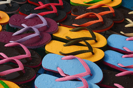 Colorful slippers with water splashedの写真素材