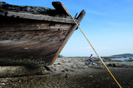 CHONBURI- JUNE 20   Unidentified man walk near shipwreck on June 20, 2014 in Ang Sila, Chonburi, Thailand  のeditorial素材