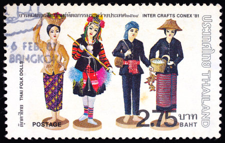 THAILAND - CIRCA 1981 : A stamp printed in Thailand shows image of Thai Folk Dolls To commemorate Iner Crafts Conex, circa 1981のeditorial素材