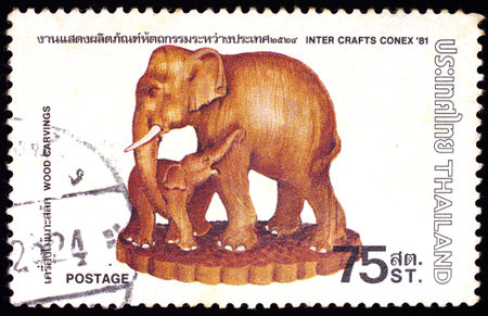 THAILAND - CIRCA 1981 : A stamp printed in Thailand shows image of Thai Wood Carvings To commemorate Iner Crafts Conex, circa 1981のeditorial素材