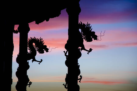 Dragon statue row the column silhouette with nice twilight skyの写真素材
