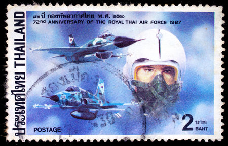 THAILAND - CIRCA 1987 : A stamp printed in Thailand shows image of Fighters, To commemorate 72nd Anniversary of the royal Thai air force, circa 1987のeditorial素材