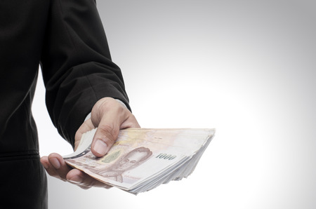 Thai money in hand, Investment concept