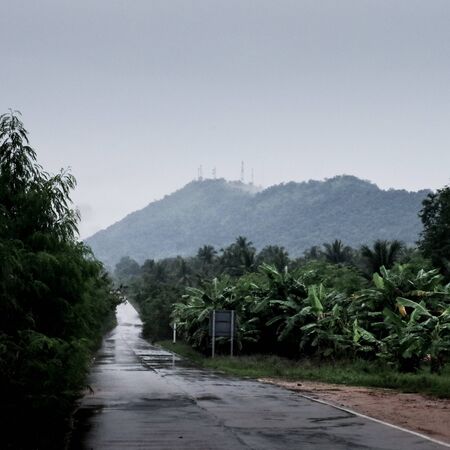 Wet road with raining sky, Thailand
