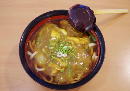 Japanese noodle curry soup on tableの写真素材