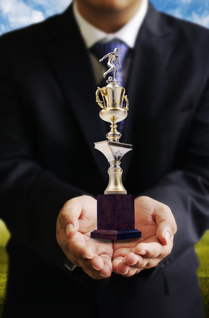 Businessman give soccer trophy, Sccess conceptの写真素材