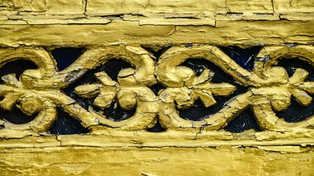 Vintage wooden art crafts in Thai style with golded color paintedの写真素材