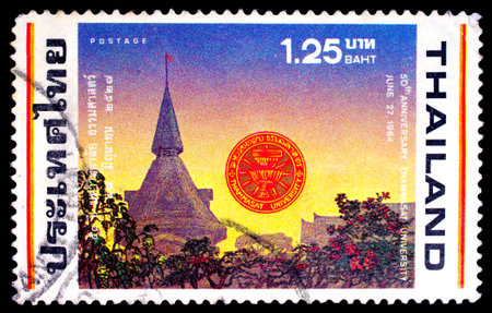 THAILAND - CIRCA 1984 : A stamp printed in Thailand shows image of University building for remind 50 th Anniverasry Thammasat University, circa 1984のeditorial素材