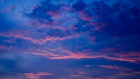 Nice twilight sky with sunset light on cloudsの写真素材