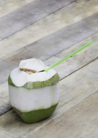 Coconut fruit for drink on wooden tableの写真素材