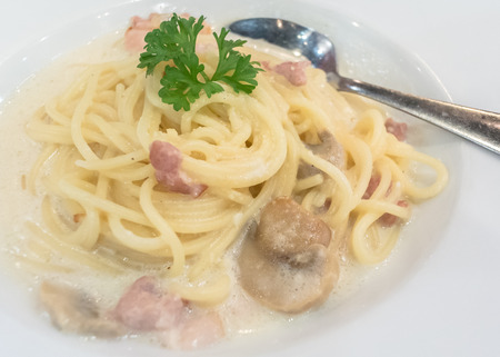 Spaghetti cabonara inside white dishの写真素材