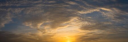 Panoramic view of nice sunset sky with cloudsの写真素材