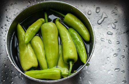 Bell pepper in bowl with waterの写真素材
