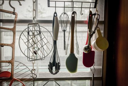 Kitchen tool hanging at windowの写真素材