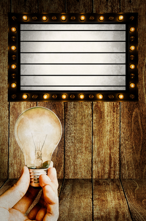 Change light bulb at vintage Light box program board の写真素材