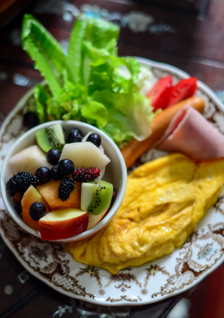 Breakfast with fruit and omeletの写真素材