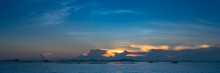Nice sun ray in twilight sky at sea with Si Chang island backgroundの写真素材