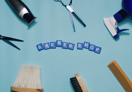 Flat lay of haircut equipment on work desk with Barber shop word, Haircut conceptの写真素材