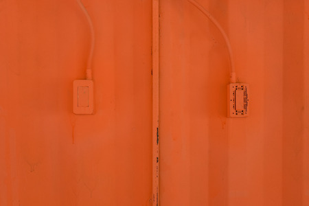 Color painted on metal wall with outlet backgroundの写真素材