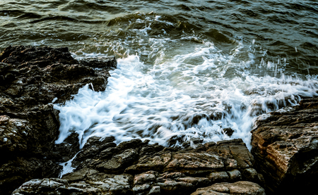 Nice sea surf splashing at rockの写真素材