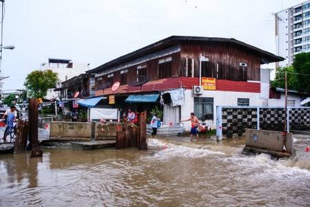 CHONBURI, THAILAND - 7 JUNE : Water from flooding after rain flow to canal at Sriracha city on 7 June 2019, Sriracha, Chonburi Thailandのeditorial素材