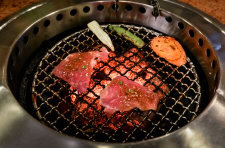 BBQ on stove, Grilled meat on hot stoveの写真素材