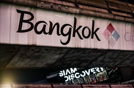 BANGKOK, THAILAND - MARCH 13 : Siam Discovery text at facade with Bangkok text at sky trail railway structure on 13 March 2019 in Bangkok, Thailandのeditorial素材