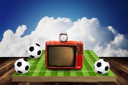 Time to watching football game with retro television の写真素材