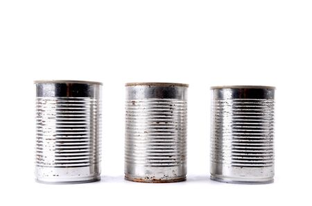 Old tin cans isolated on white background