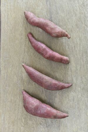 Group of yams on wooden backgroundの写真素材
