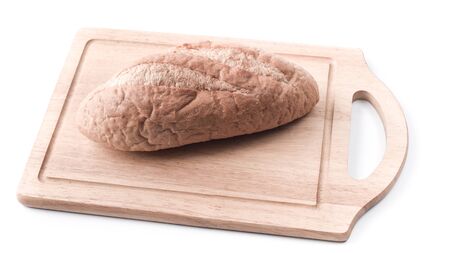 Sourdough Loaf on wooden cutting board isolated on white backgroundの写真素材