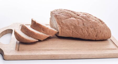 Sourdough Loaf sliced isolated on white backgroundの写真素材