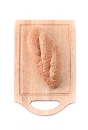 Sourdough Loaf on wooden cutting board isolated on white backgroundの写真素材