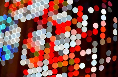 Abstract led lights bokeh pattern background at nightの写真素材