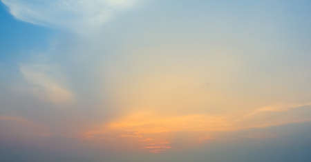 Vibrant evening sky with clouds backgroundの写真素材