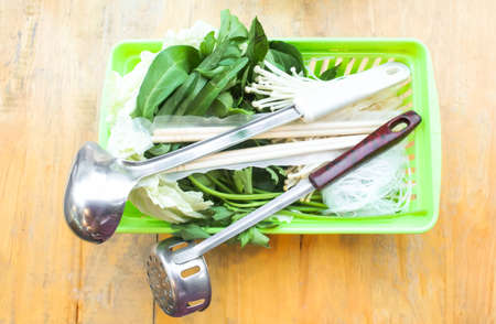 Fresh vegetable with mushrooms in basket ready for cook in hot potの写真素材