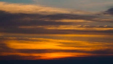 Clouds and sunset light at skyの写真素材