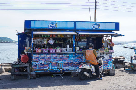 SRIRACHA, THAILAND - 19 AUG : Motorcycle taxi parking at shop at jetty on 19 August 2020 in Sriracha, Chonburi, Thailandのeditorial素材