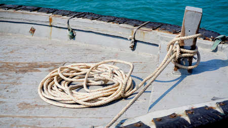 Rope rolled on fishing boat with sea backgroundの写真素材