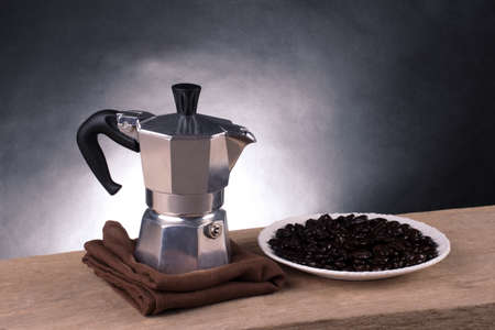 Moka pot with roasted coffee beansの写真素材