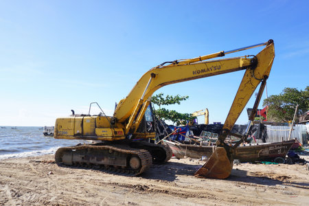 BANGSAEN, THAILAND - 19 FEB : Excavator rest on beach after clear jetty structure at Wonnapa beach...