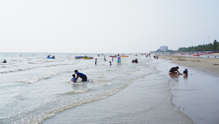 BANGSAEN, THAILAND - 12 March : People relaxing at beach on 12 March 2022 in Bangsaen, Chonburi, Thailandのeditorial素材