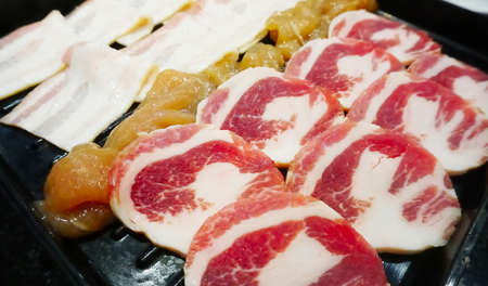 Raw meat set in tray for BBQ, High angleの写真素材