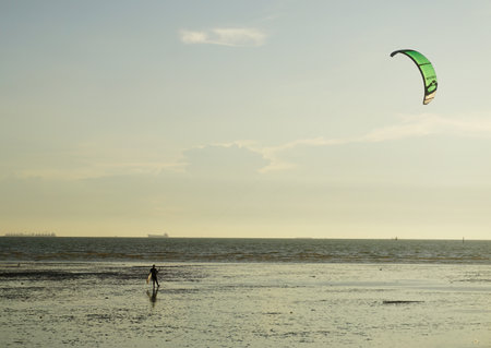 CHONBURI, THAILAND - 26 MARCH : Kite surf at sea with sunset sky background on 26 March 2022 in BangSaen, Chonburi, Thailandのeditorial素材