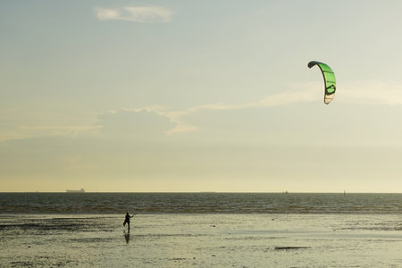 CHONBURI, THAILAND - 26 MARCH : Kite surf at sea with sunset sky background on 26 March 2022 in BangSaen, Chonburi, Thailandのeditorial素材