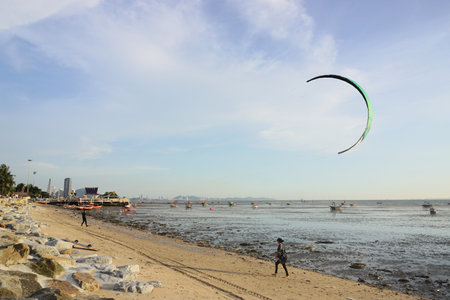 CHONBURI, THAILAND - 26 MAR : Kite surfer at beach on 26 March 2022 in Bangsaen beach, Chonburi, Thailandのeditorial素材